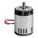 A small round metal device with wires and a red wire.