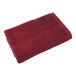 A red 1888 Mills Millennium bath sheet.