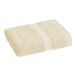 A beige hand towel with a white stripe.