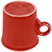 A Scarlet Fiesta china mug with a handle on a white background.