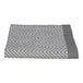 A grey and white towel with a chevron pattern.