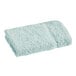 A close-up of a seafoam green 1888 Mills Fibertone washcloth.