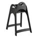 A black Koala Kare designer high chair with a wooden seat.