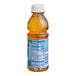 A close-up of a Tropicana Apple Juice bottle.