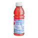 A close-up of a Tropicana Ruby Red Grapefruit Juice bottle with red liquid and a label.