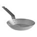 A Choice carbon steel frying pan with a handle.