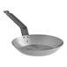 A Choice carbon steel frying pan with a handle.