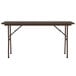 A brown rectangular Correll folding table with metal legs.