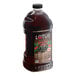 A large bottle of Lotus Plant Energy Ruby Red Cascara 5:1 energy concentrate with a label.