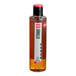 A SHOTT Vanilla Flavoring Syrup bottle of liquid with a red cap.