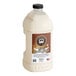 A white plastic container of Lotus Original Vanilla Oat Cream Base with a brown label.