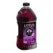 A bottle of Lotus Plant Power Purple Lotus 5:1 Energy Concentrate, a purple liquid in a plastic container.