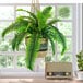 A 30" artificial Boston fern in a tri-color hanging basket.