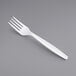 A close up of a Choice white plastic fork.