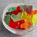 A bowl of Albanese Large Gummi Butterflies on a table.