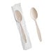 A beige heavy weight polystyrene plastic teaspoon, with one spoon individually wrapped in plastic and one unwrapped.