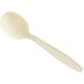 A close-up of a beige plastic soup spoon with a handle.