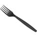 A pack of 100 Choice black heavy weight plastic forks with black handles.