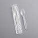 A plastic bag with wrapped Choice Clear plastic spoons.