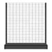 A black metal Wanzl Wire Tech gondola shelf with a wire grid on top.
