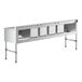 A Regency stainless steel underbar sink with four compartments and two drainboards.