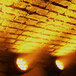 Three Prost Lighting UberBar LED wash lights shining on a brick wall.