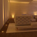 A room in a lounge area with Ape Labs Mini LED lights on a couch and chairs.
