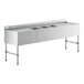 A stainless steel Regency underbar sink with three bowls and two drainboards.