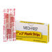 A box of Medi-First 1" x 3" adhesive bandage strips with one individually wrapped bandage shown.