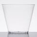 A clear plastic Fineline Savvi Serve tumbler on a white surface.