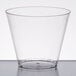 A clear Fineline hard plastic squat tumbler on a white surface.