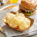 A burger and Lay's Classic Potato Chips on a tray.