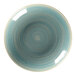 A close-up of a RAK Porcelain Sapphire deep coupe plate with a blue and white swirl pattern.