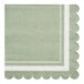 A green Sophistiplate paper cocktail napkin with white scalloped edges.