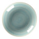 A close-up of a RAK Porcelain blue and white spiral pattern on a plate.
