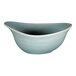 A close-up of a RAK Porcelain Sapphire blue bowl with a white interior.