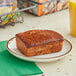 A slice of Ne-Mo's Bakery banana cake bread on a plate.