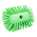 A Carlisle lime green circular brush with bristles.