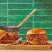 Two Eat Meati plant-based steak sliders on a cutting board.