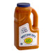 A plastic bottle of Sweet Baby Ray's Garlic Buffalo Wing sauce with a label.