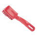 A red Carlisle Sparta detail brush with a handle.