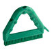 A green Carlisle Sparta Spectrum grout brush with a handle.