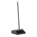 A black dustpan with a long handle.