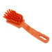 A Carlisle Sparta orange detail brush with a handle.