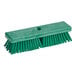 A green Carlisle Sparta deck scrub brush with long bristles.