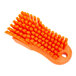 An orange Carlisle Sparta handheld scrub brush with bristles.