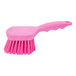 A pink Carlisle Sparta pot scrub brush with a handle.