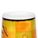 A Huhtamaki paper soup cup with a yellow and orange design.