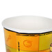 A close up of a Huhtamaki paper soup cup with a design of a cartoon character.