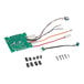 A green Robot Coupe circuit board with wires and screws.